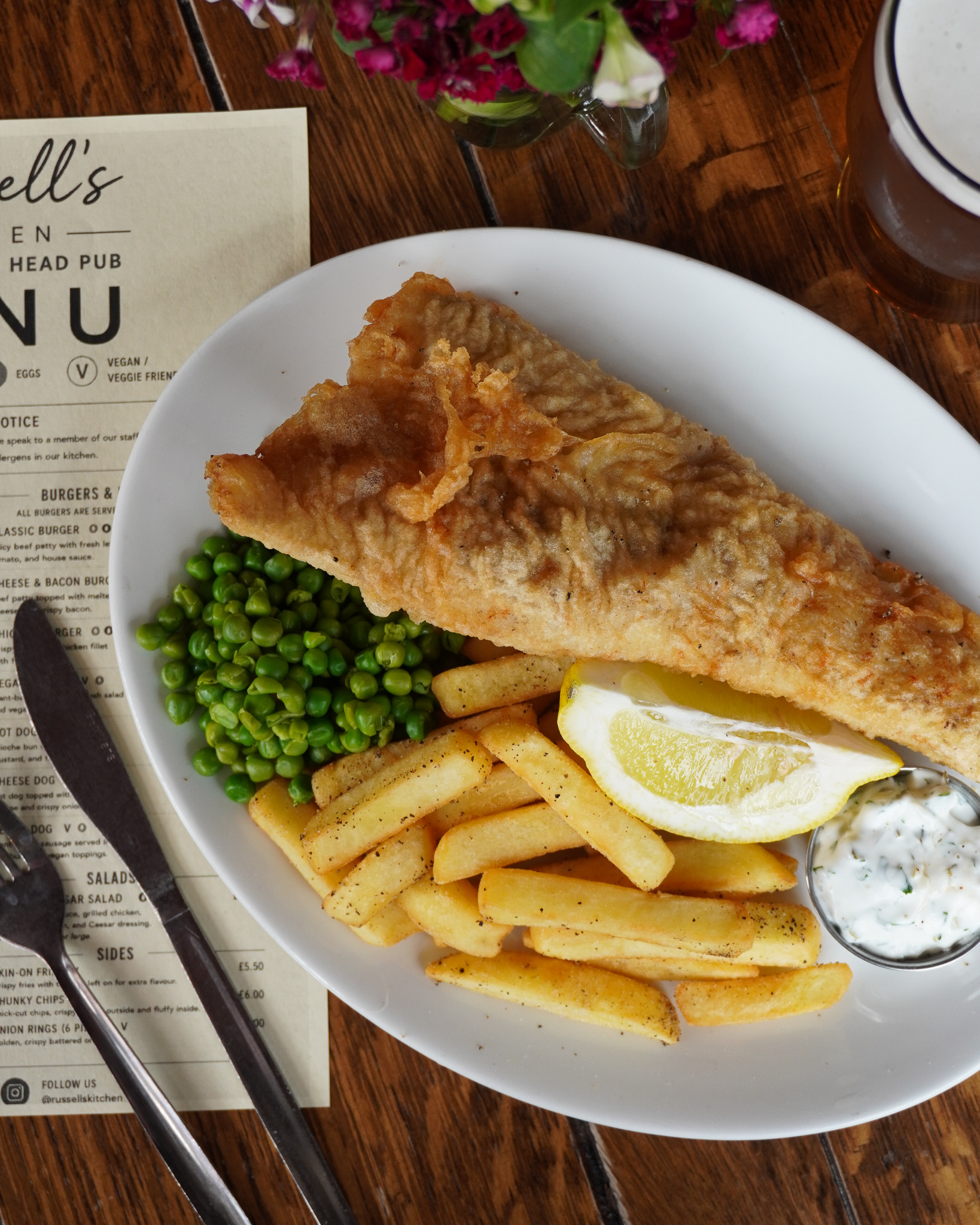 Photo of fish and chips with peas