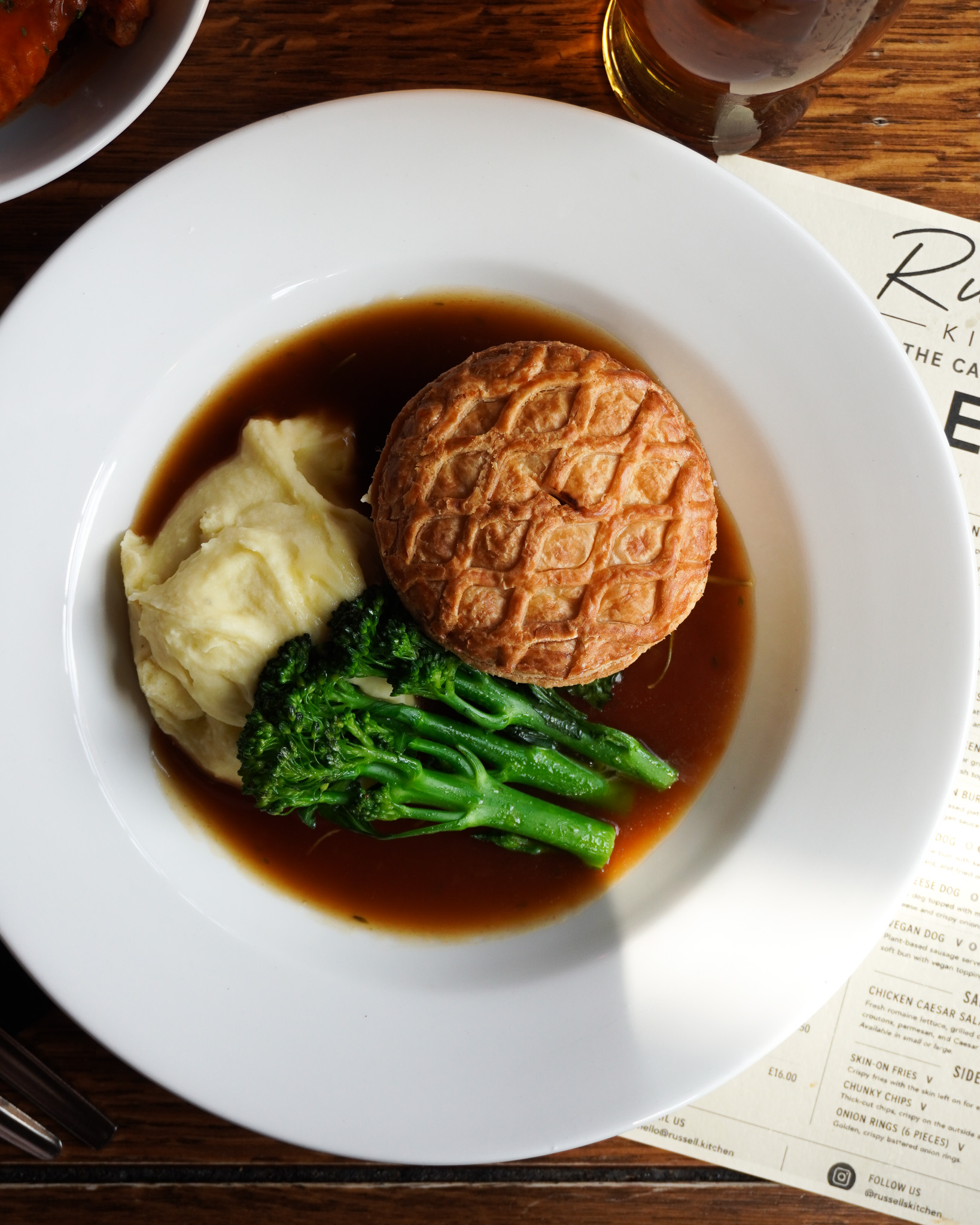 Photo of Pie, mash and broccoli in gravy