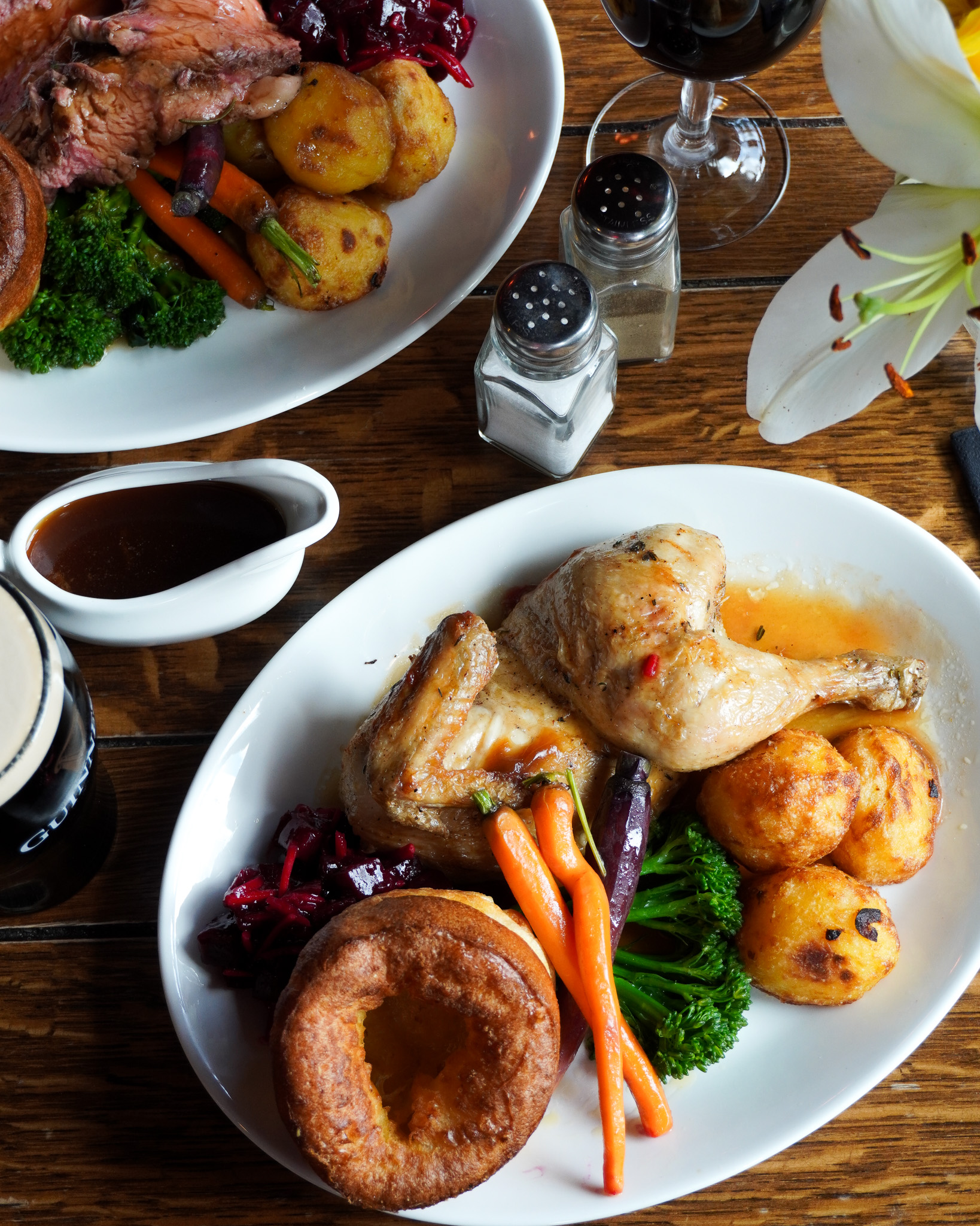 Photo of a table set with two Sunday Roasts and gravy