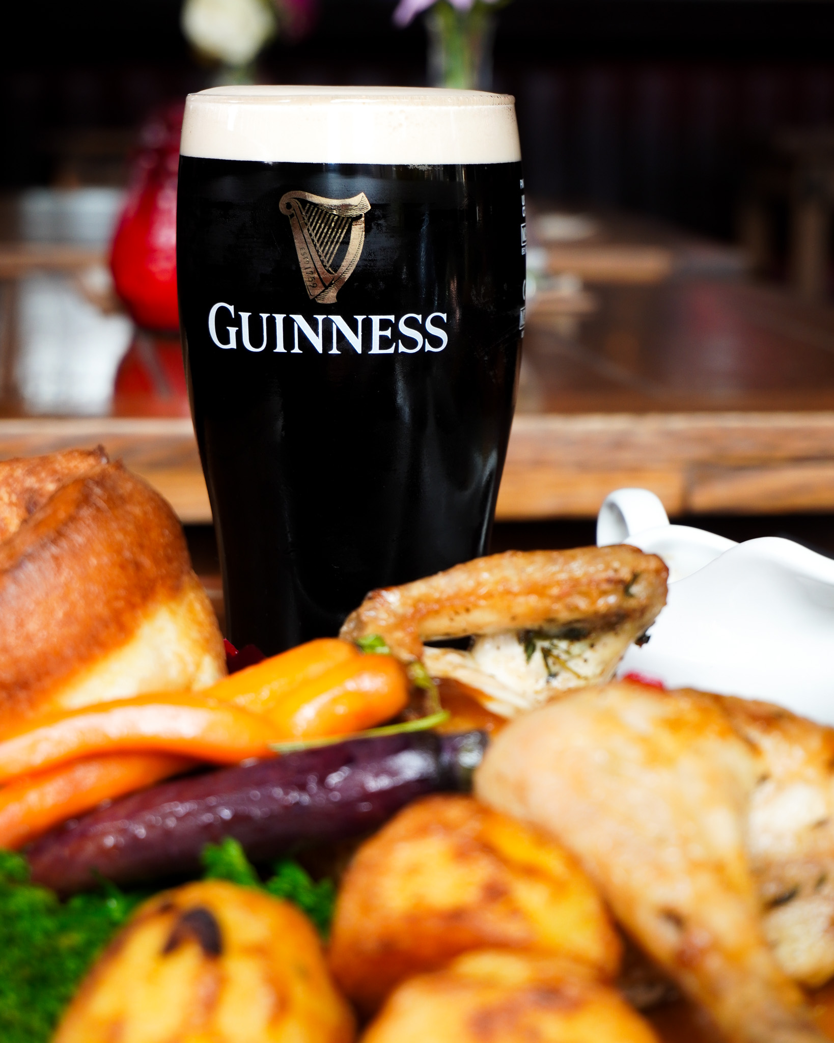 Photo of roast chicken with a pint of Guinness